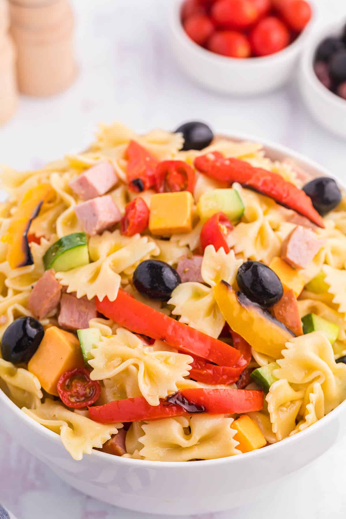 A bowl of roasted pepper pasta salad.