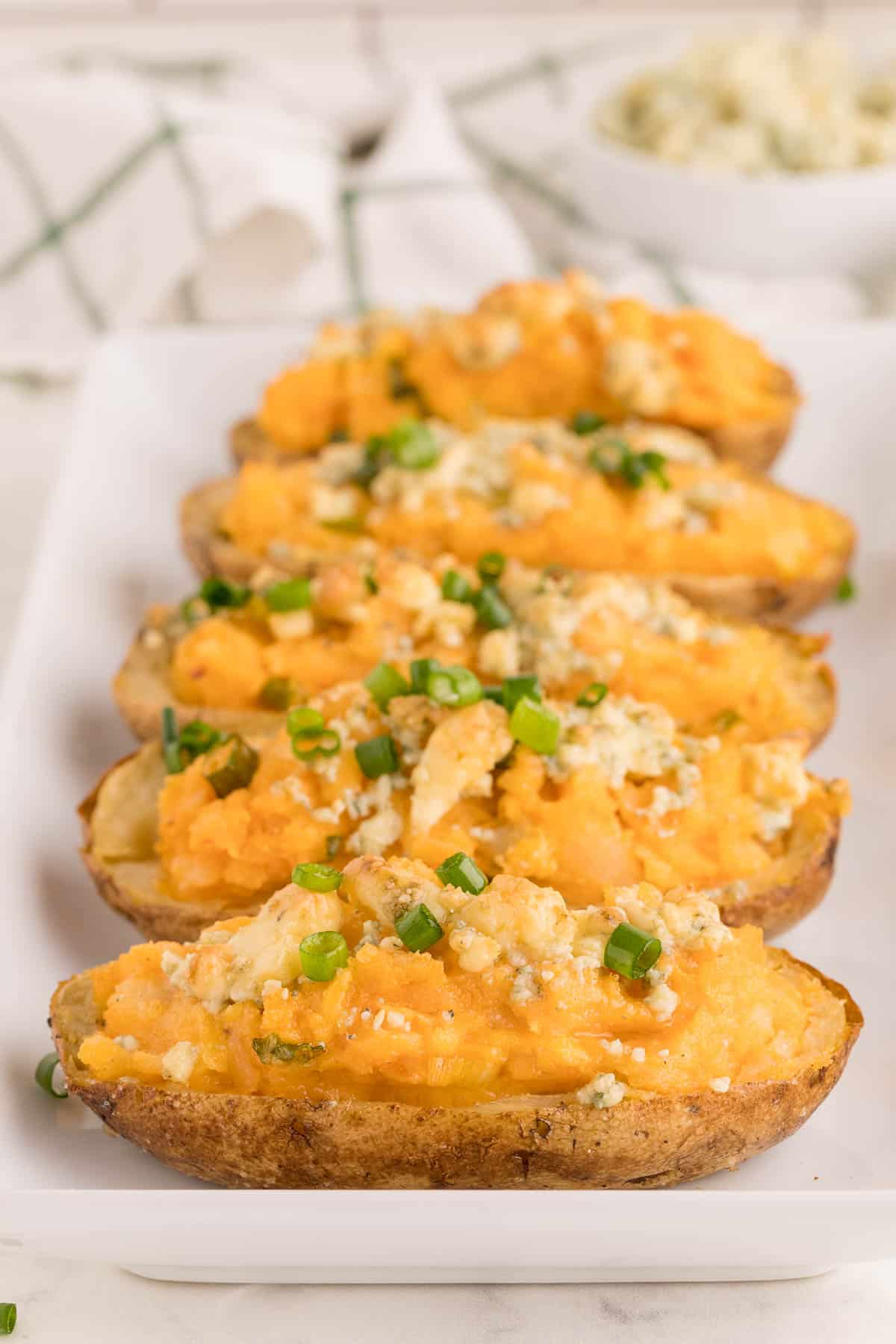 Buffalo Twice Baked Potatoes on a white platter.