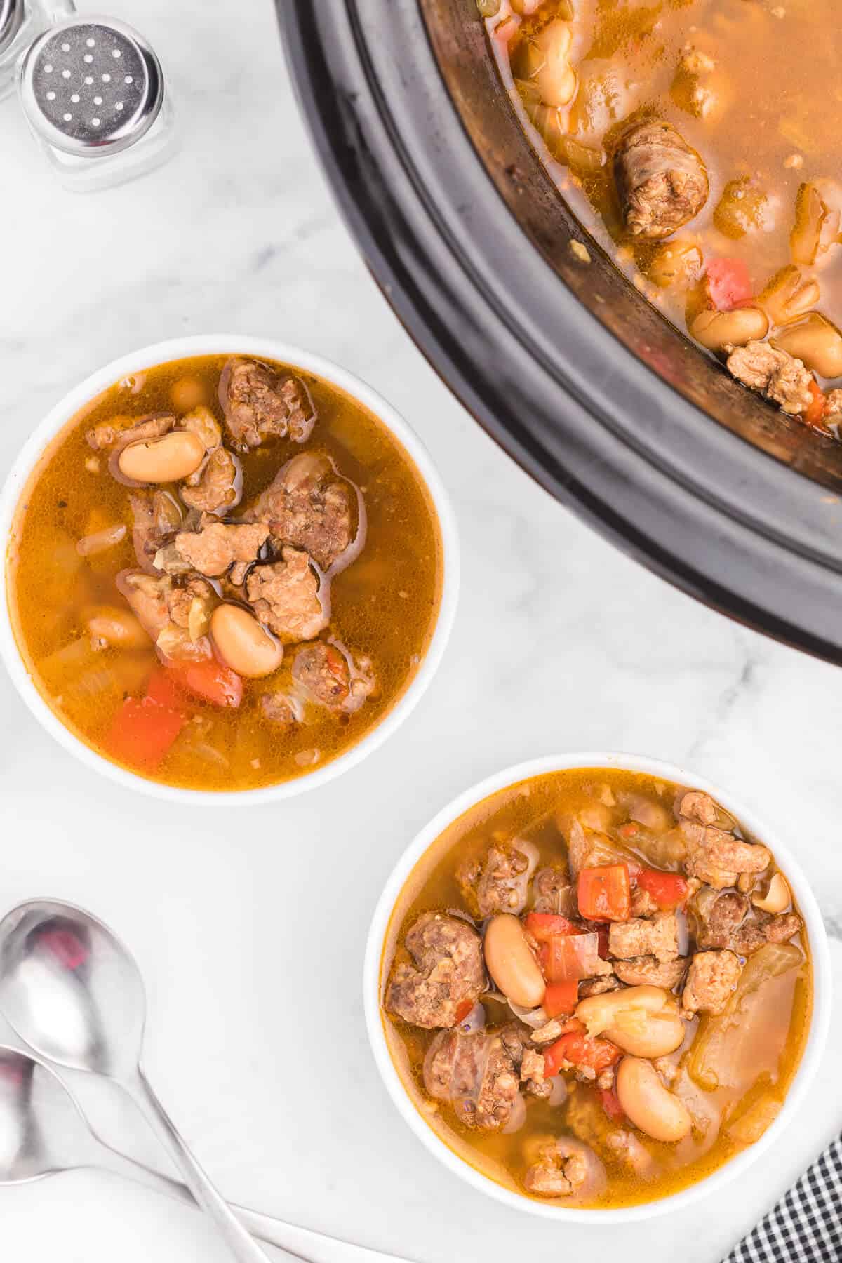 Chicken Sausage Soup - The most comforting winter soup! Load up the slow cooker with ground chicken, beer and sliced Italian sausage in this broth-based soup.