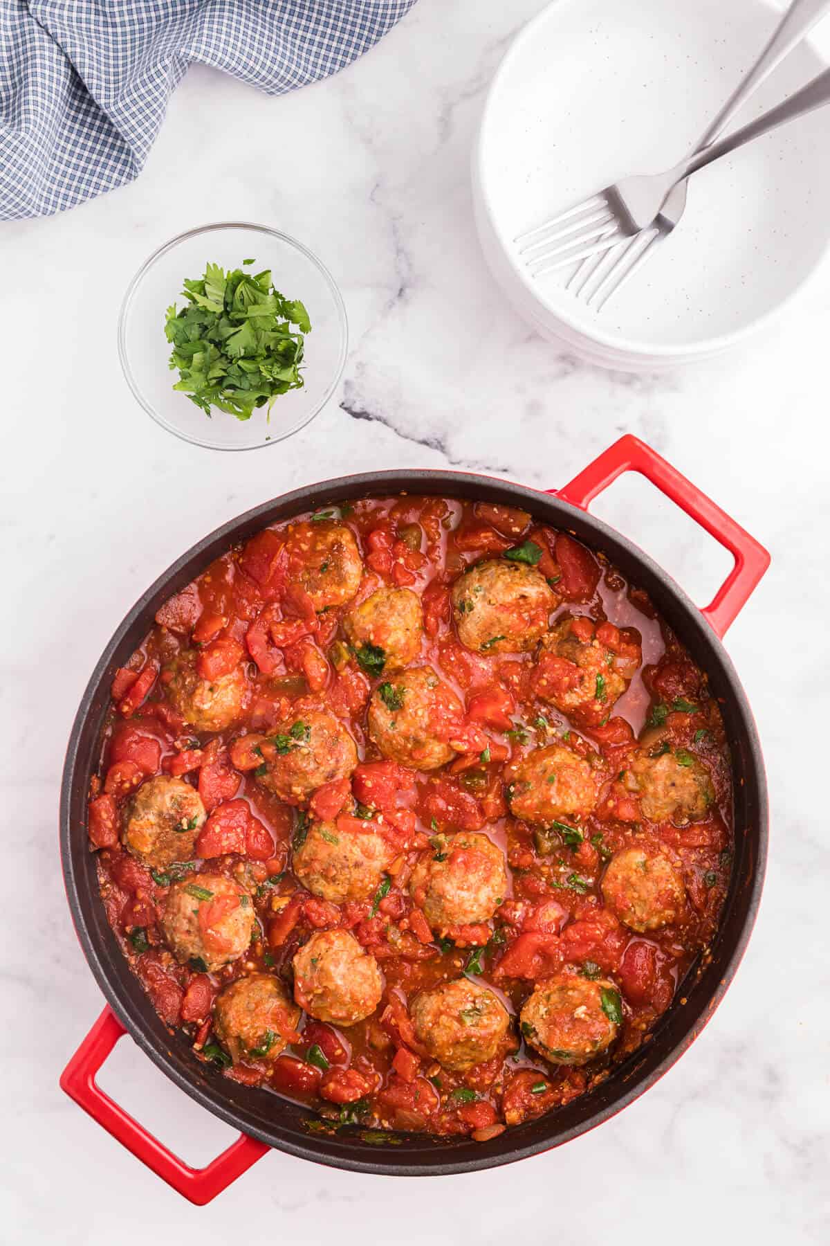 Mexican meatballs in a red skillet.