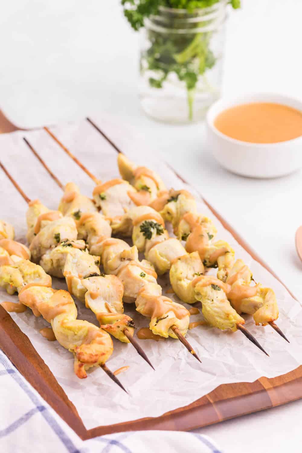 Chicken Satay with Peanut Sauce - This simple appetizer is a great crowd-pleaser! The homemade dipping sauce makes this easy recipe. Make them in the oven!