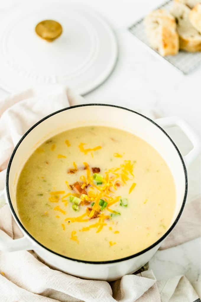 Loaded Baked Potato Soup -Your favorite side dish turned soup! This hearty soup recipe is loaded just like your favorite steakhouse — bacon, green onions, sour cream, and of course, cheese.