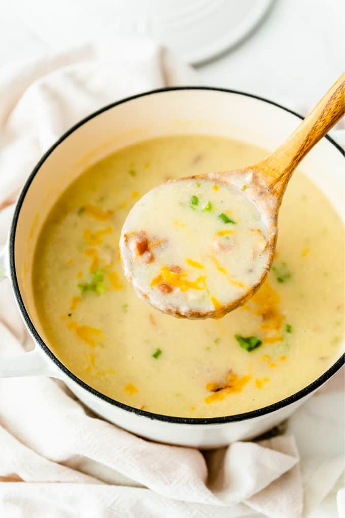 Loaded Baked Potato Soup -Your favorite side dish turned soup! This hearty soup recipe is loaded just like your favorite steakhouse — bacon, green onions, sour cream, and of course, cheese.