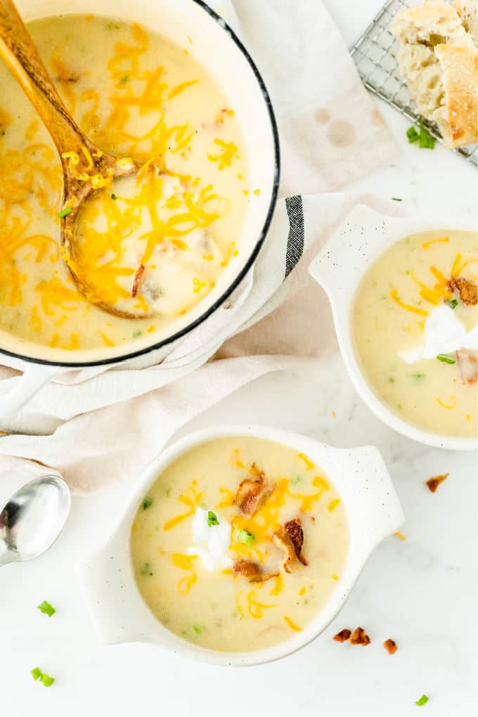 Loaded Baked Potato Soup -Your favorite side dish turned soup! This hearty soup recipe is loaded just like your favorite steakhouse — bacon, green onions, sour cream, and of course, cheese.