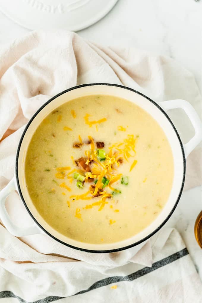 Loaded Baked Potato Soup -Your favorite side dish turned soup! This hearty soup recipe is loaded just like your favorite steakhouse — bacon, green onions, sour cream, and of course, cheese.