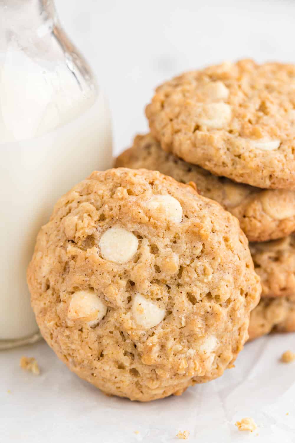 white chocolate oatmeal cookies with a glass of milk