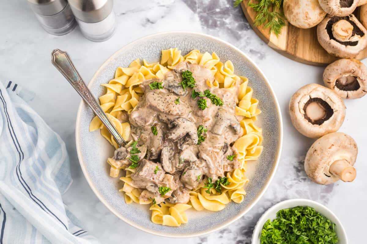 Beef stroganoff on a plate with a fork.