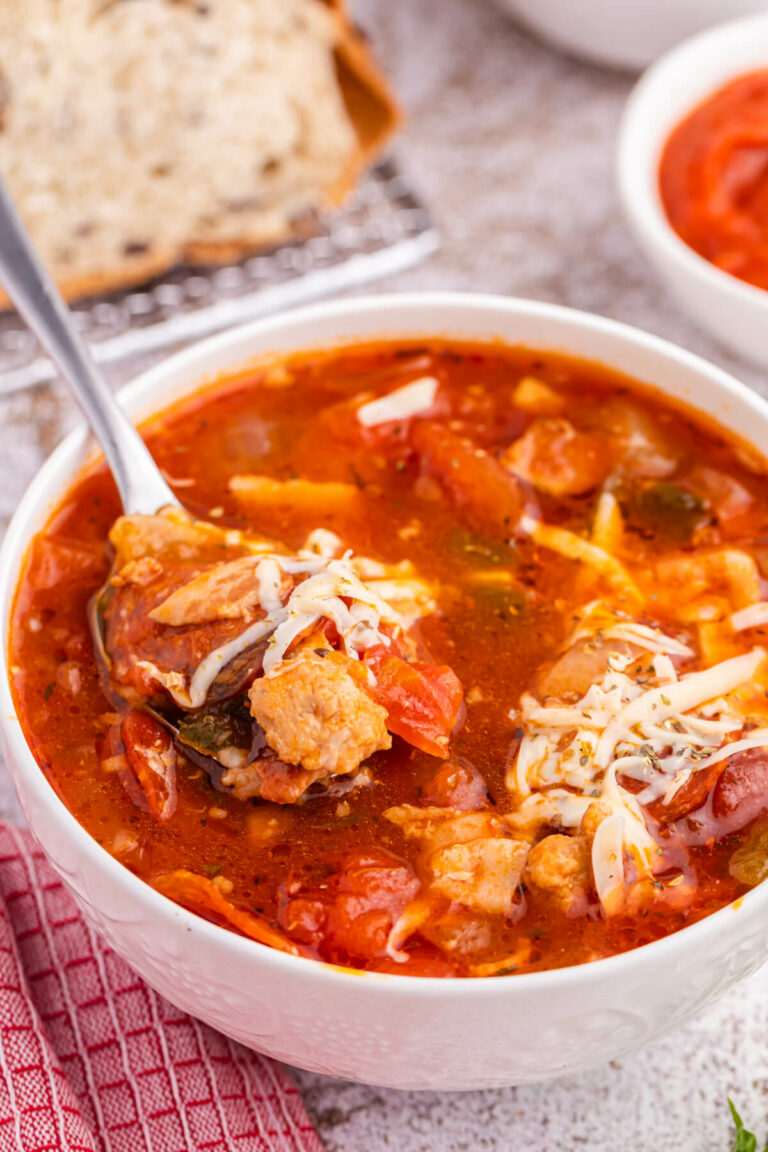The soup in a bowl with a spoon.
