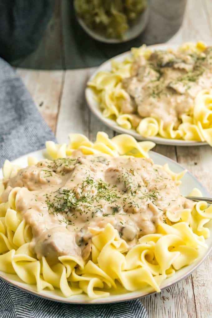 Slow Cooker Beef Stroganoff - A classic recipe made with a creamy mushroom sauce, steak and served over a bed of tender egg noodles. A family favorite!