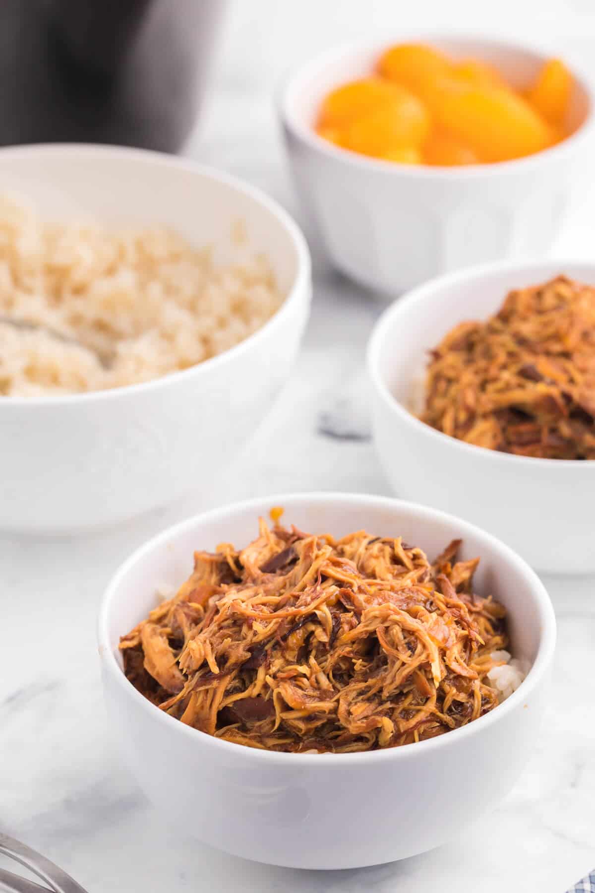 Slow Cooker Cranberry Orange Chicken - Add a tangy twist to your orange chicken! This Crockpot chicken recipe is perfect for the holiday season with cranberry sauce, ginger, and balsamic vinegar in this Asian-inspired main dish.