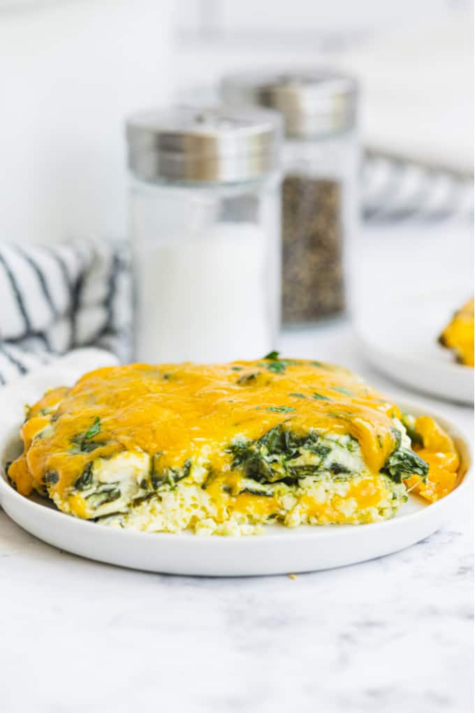 Slow Cooker Spinach & Feta Quiche - Make this low-carb quiche in the Crockpot for your next brunch. It's a great savory breakfast recipe with spinach and 3 types of cheese. Yum!