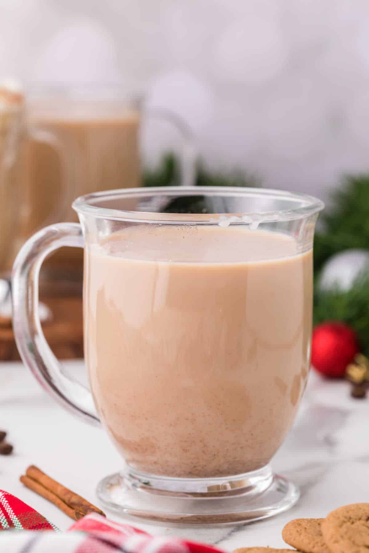 Gingerbread latte in a glass mug.