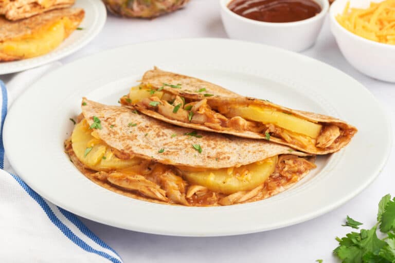 BBQ chicken and pineapple quesadillas on a plate.
