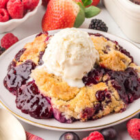 The recipe on a plate topped with a scoop of vanilla ice cream.