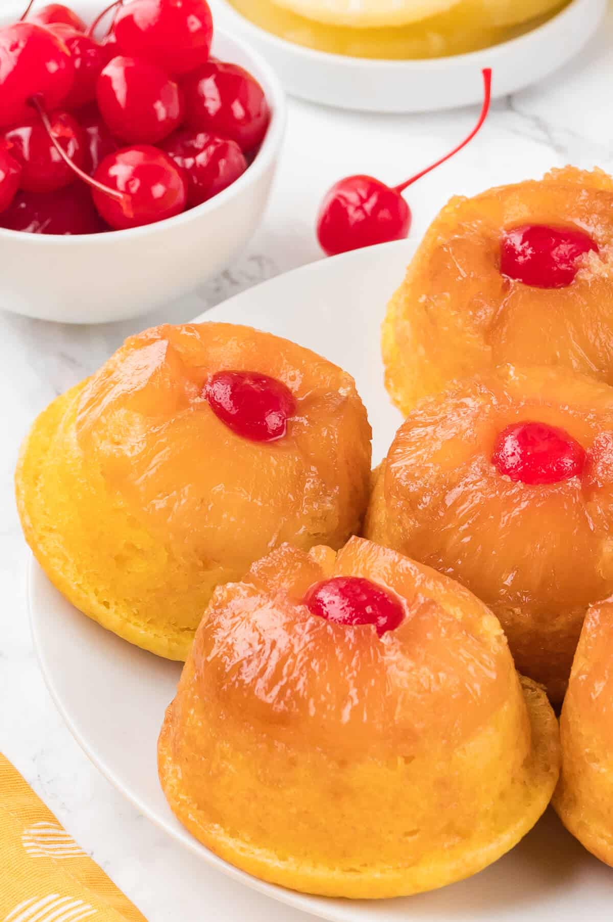 Pineapple Upside Down Cupcakes on a plate.