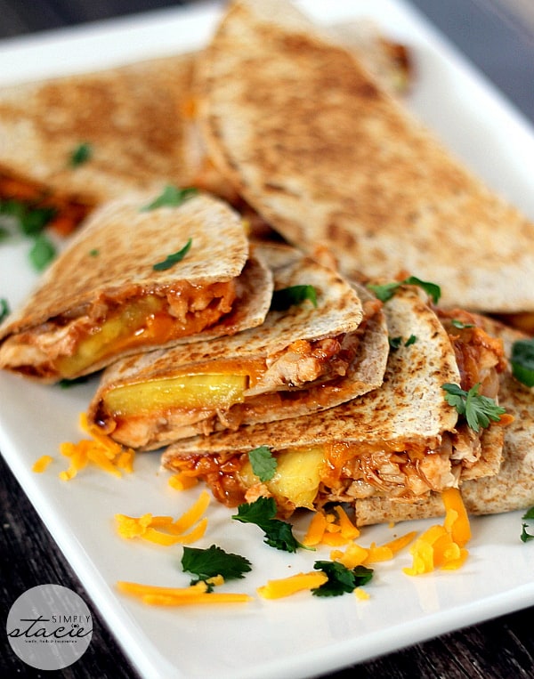 BBQ Chicken & Pineapple Quesadillas - A modern twist on the classic Mexican handheld meal! Smothered in smoky sauce, tender chicken and juicy pineapple, it's the perfect sweet and savory recipe.