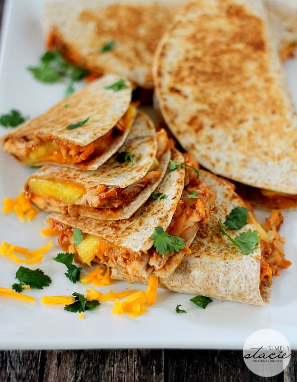 BBQ Chicken & Pineapple Quesadillas - A modern twist on the classic Mexican handheld meal! Smothered in smoky sauce, tender chicken and juicy pineapple, it's the perfect sweet and savory recipe.