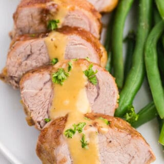 Brown Sugar Dijon Pork Tenderloin - Only two ingredients for this delicious dinner recipe! This sweet and savory glaze goes perfectly with the tender, juicy pork.