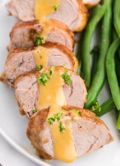 Brown Sugar Dijon Pork Tenderloin - Only two ingredients for this delicious dinner recipe! This sweet and savory glaze goes perfectly with the tender, juicy pork.