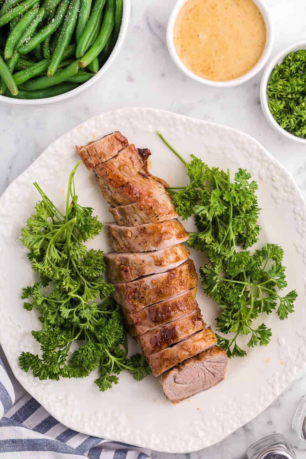 Brown Sugar Dijon Pork Tenderloin - Only two ingredients for this delicious dinner recipe! This sweet and savory glaze goes perfectly with the tender, juicy pork.