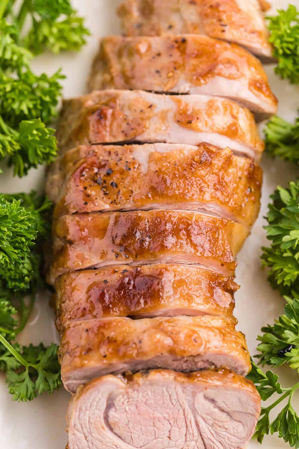 Brown Sugar Dijon Pork Tenderloin - Only two ingredients for this delicious dinner recipe! This sweet and savory glaze goes perfectly with the tender, juicy pork.