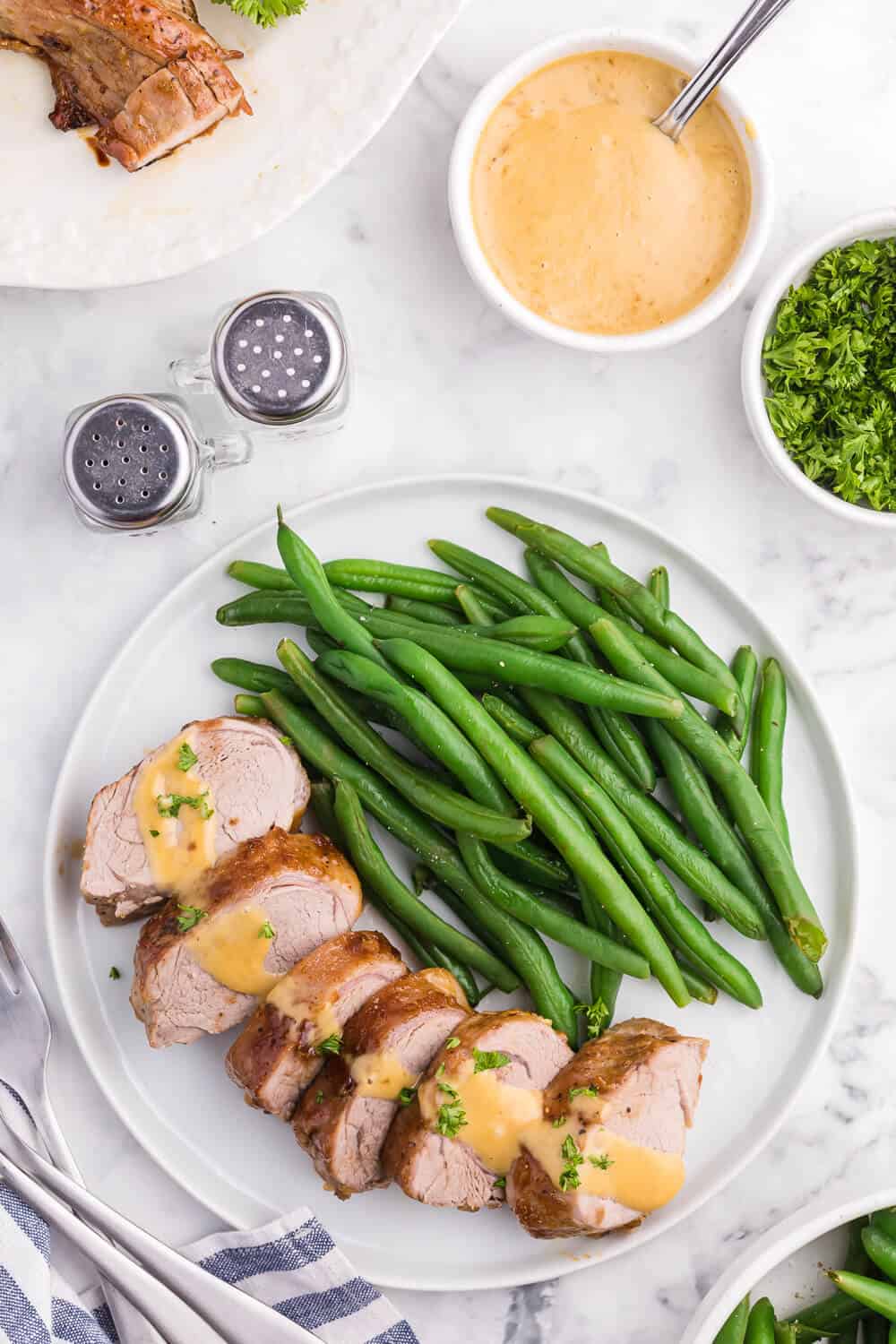 Brown Sugar Dijon Pork Tenderloin - Only two ingredients for this delicious dinner recipe! This sweet and savory glaze goes perfectly with the tender, juicy pork.