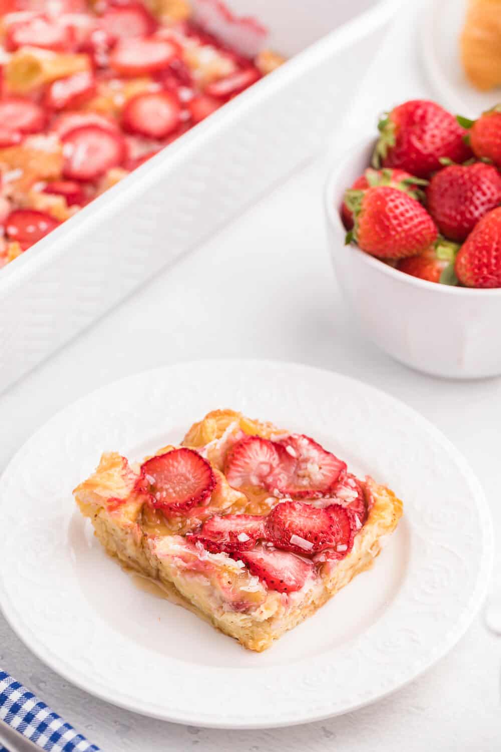 Strawberry & Coconut Breakfast Casserole - This is such a quick and easy overnight breakfast casserole to throw together. The strawberries add a beautiful colour, and the coconut is a delicious surprise flavour!