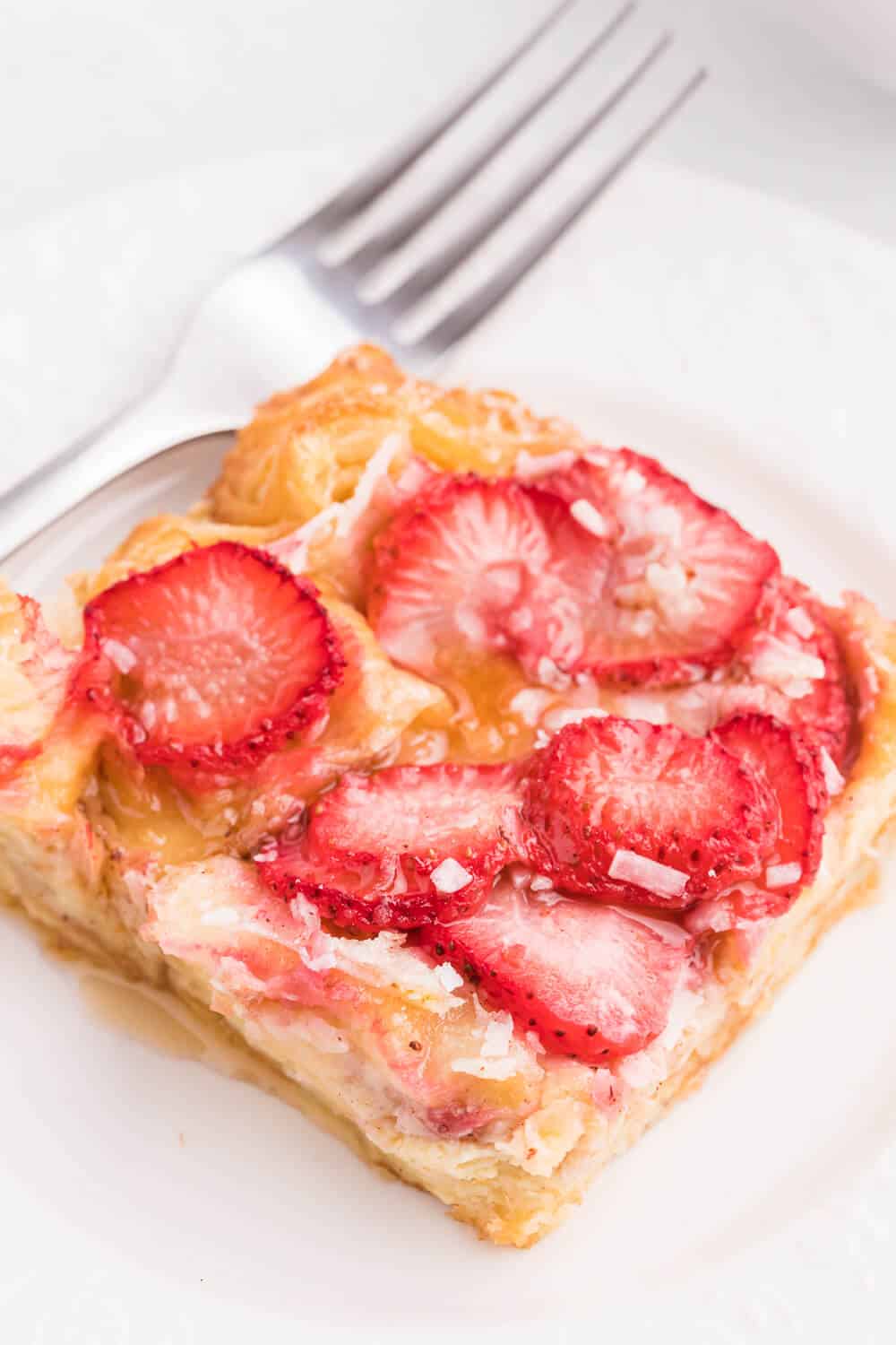 Strawberry & Coconut Breakfast Casserole - This is such a quick and easy overnight breakfast casserole to throw together. The strawberries add a beautiful colour, and the coconut is a delicious surprise flavour!