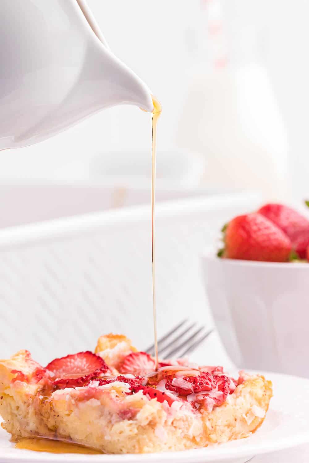 Strawberry & Coconut Breakfast Casserole - This is such a quick and easy overnight breakfast casserole to throw together. The strawberries add a beautiful colour, and the coconut is a delicious surprise flavour!