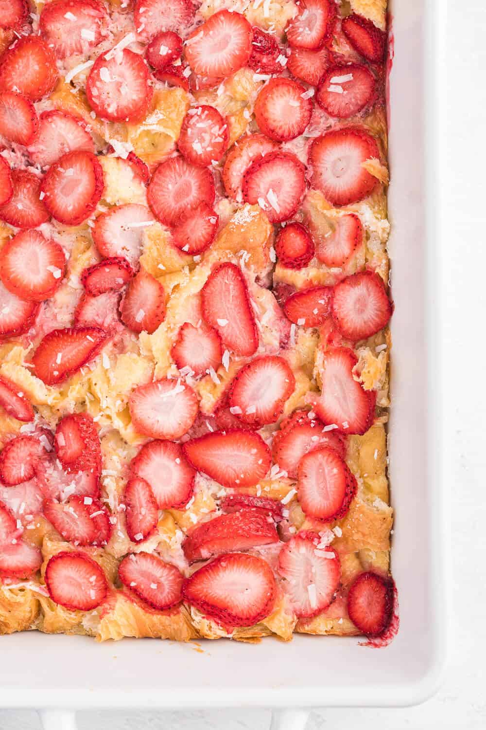 Strawberry & Coconut Breakfast Casserole - This is such a quick and easy overnight breakfast casserole to throw together. The strawberries add a beautiful colour, and the coconut is a delicious surprise flavour!