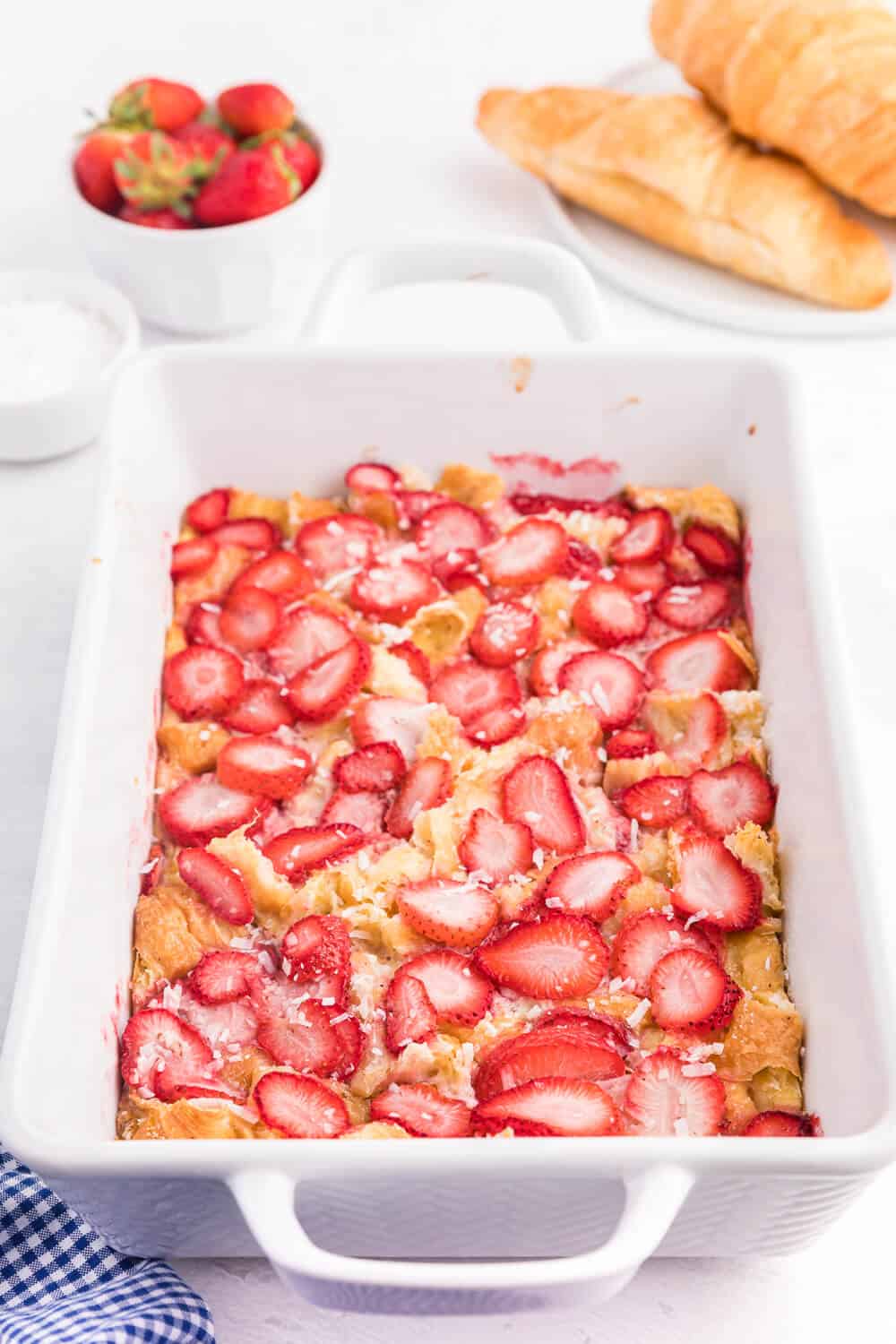 Strawberry & Coconut Breakfast Casserole - This is such a quick and easy overnight breakfast casserole to throw together. The strawberries add a beautiful colour, and the coconut is a delicious surprise flavour!