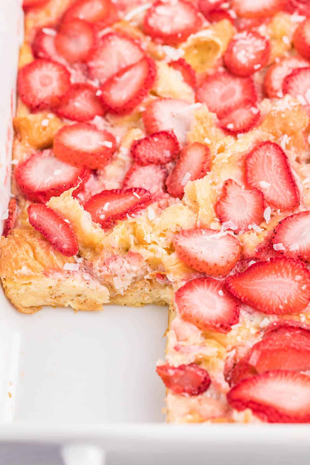 Strawberry & Coconut Breakfast Casserole - This is such a quick and easy overnight breakfast casserole to throw together. The strawberries add a beautiful colour, and the coconut is a delicious surprise flavour!