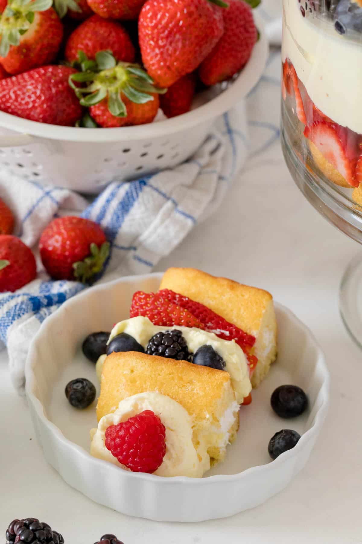 Berry cheesecake trifle served on a plate.