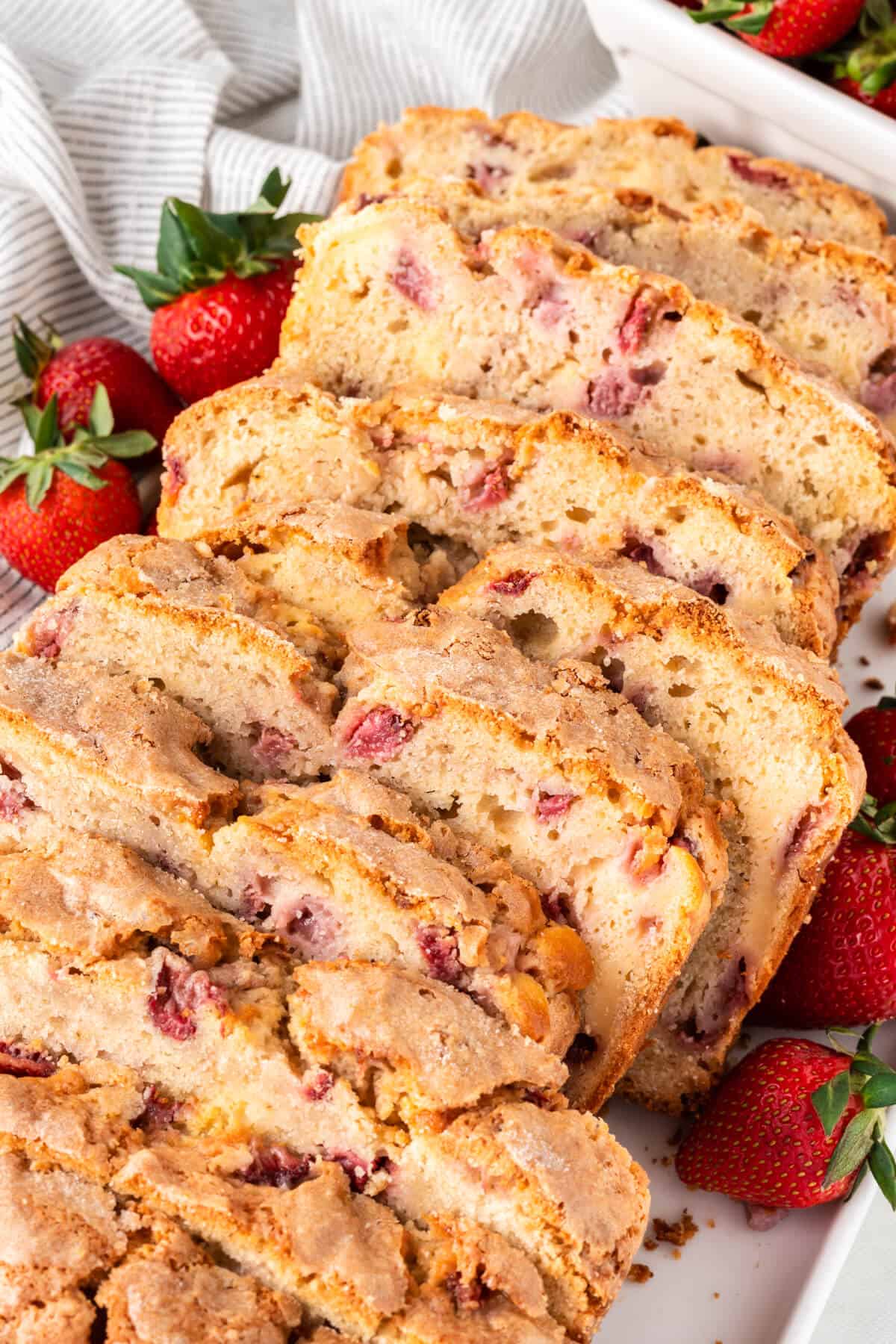 Strawberry bread sliced on a platter.