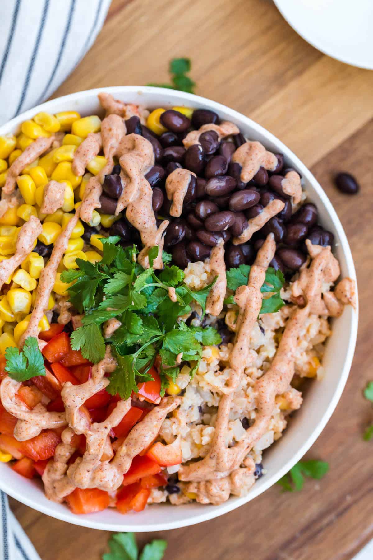 A bowl of cauliflower rice enchilada bowl.