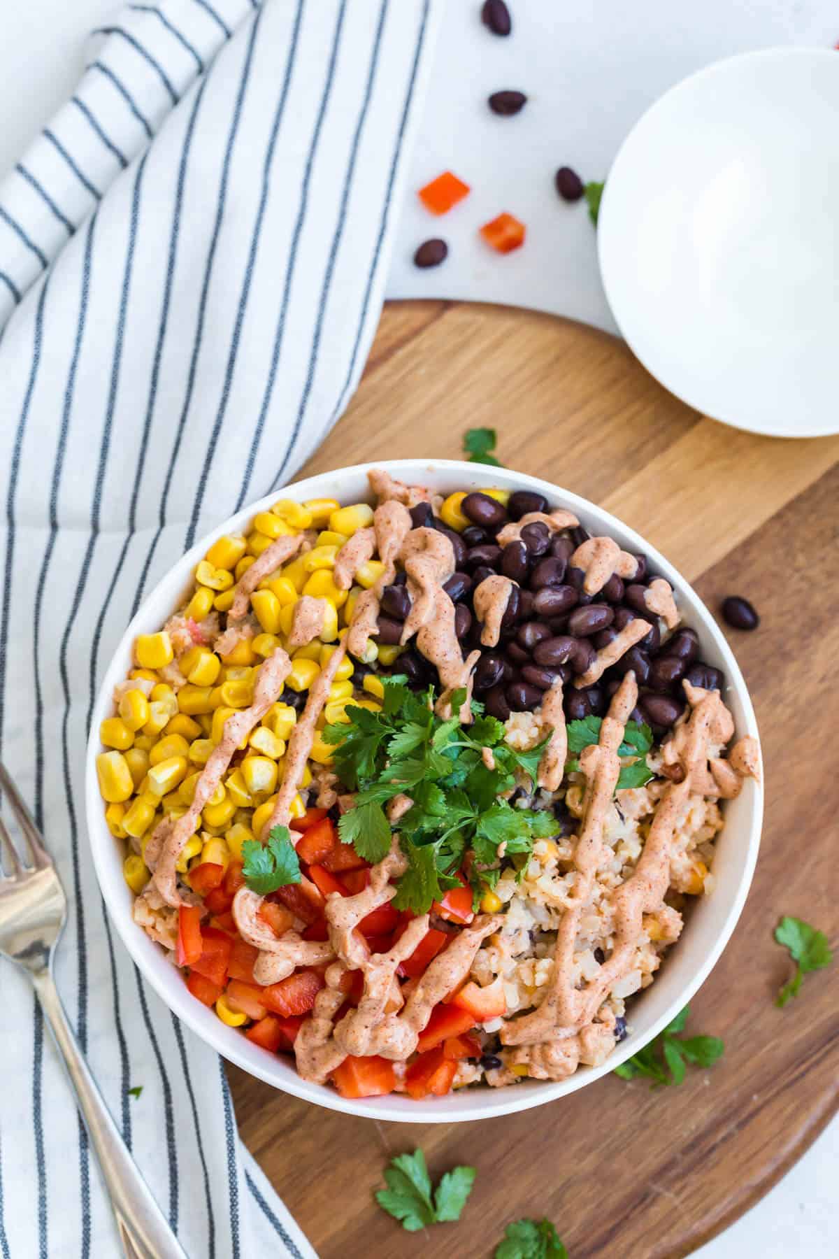 Cauliflower rice enchilada bowl with all the fixings.