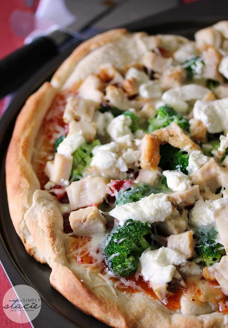 Sweet Chili Chicken Thai Pizza - East meets West for this out-of-the-box homemade pizza recipe! Ditch the pepperoni for chicken, broccoli, Thai sweet chili sauce, sundried tomatoes, and goat cheese.