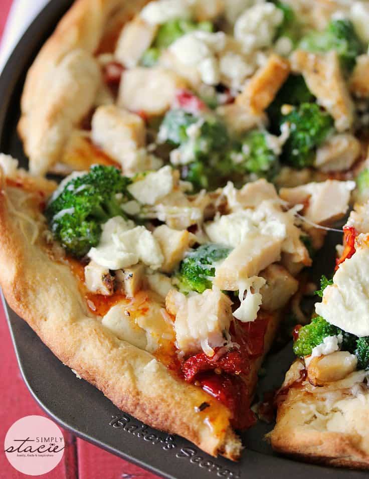 Sweet Chili Chicken Thai Pizza - East meets West for this out-of-the-box homemade pizza recipe! Ditch the pepperoni for chicken, broccoli, Thai sweet chili sauce, sundried tomatoes, and goat cheese.