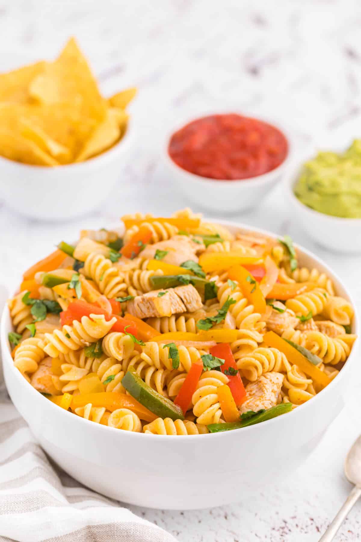 Chicken fajita pasta salad in a white bowl.