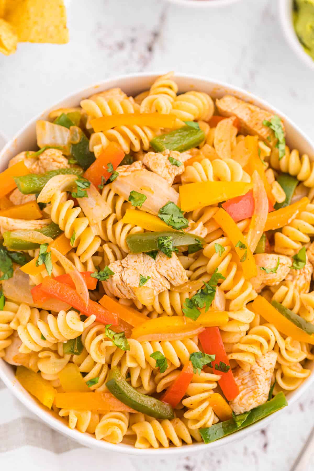 Chicken fajita pasta salad in a white bowl.