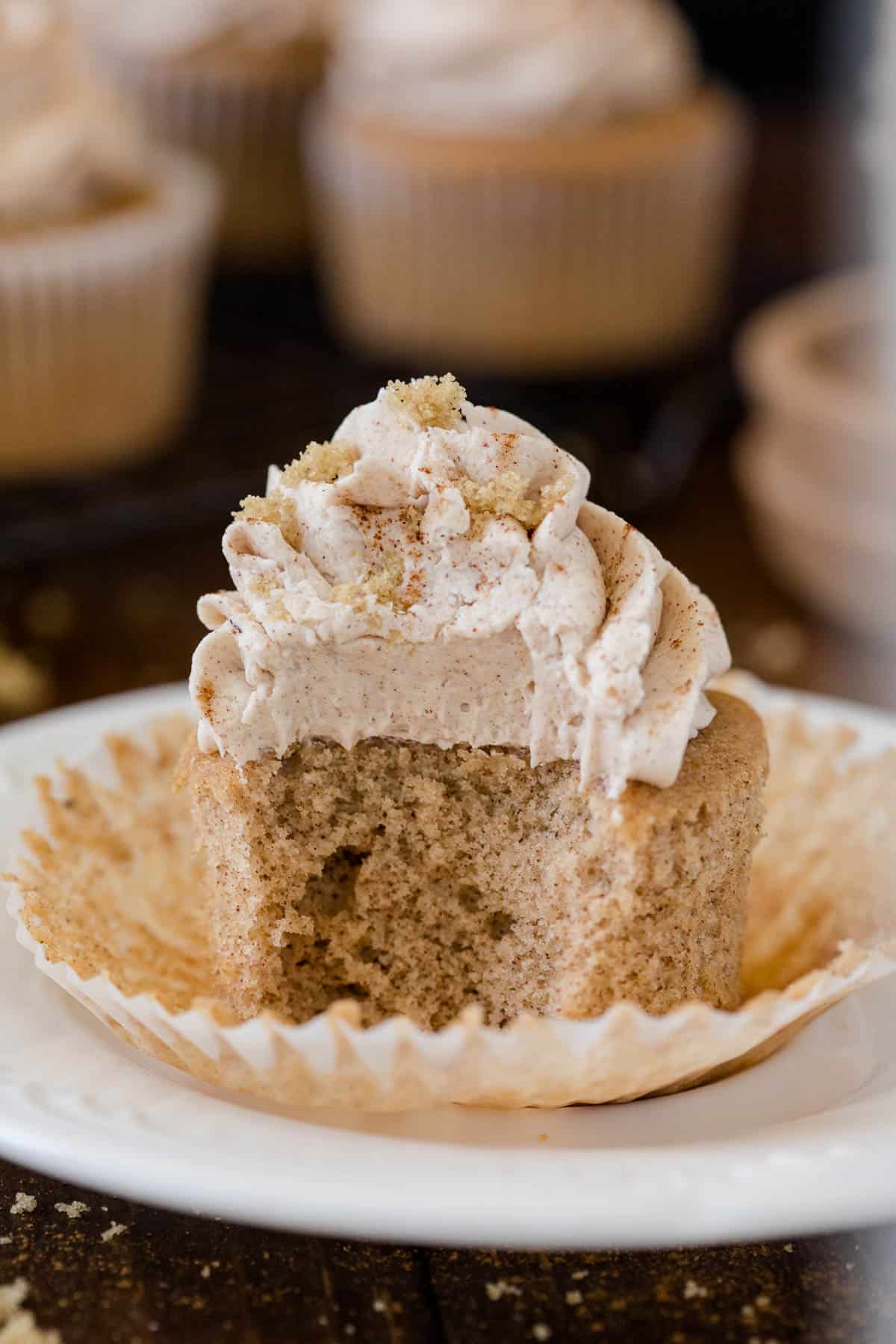 A cupcake with a bite out of it.