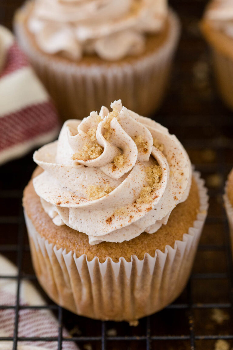 A cupcake on a wire rack.