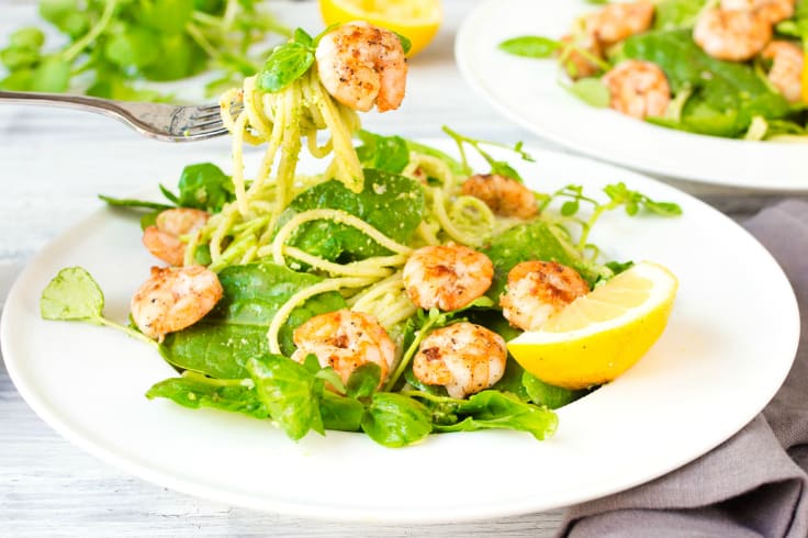 Garlic Shrimp with Chilli Pesto Pasta - Skip the jarred spaghetti sauce! Homemade pesto is the best complement for these sweet and spicy shrimp on a bed of noodles and baby spinach.