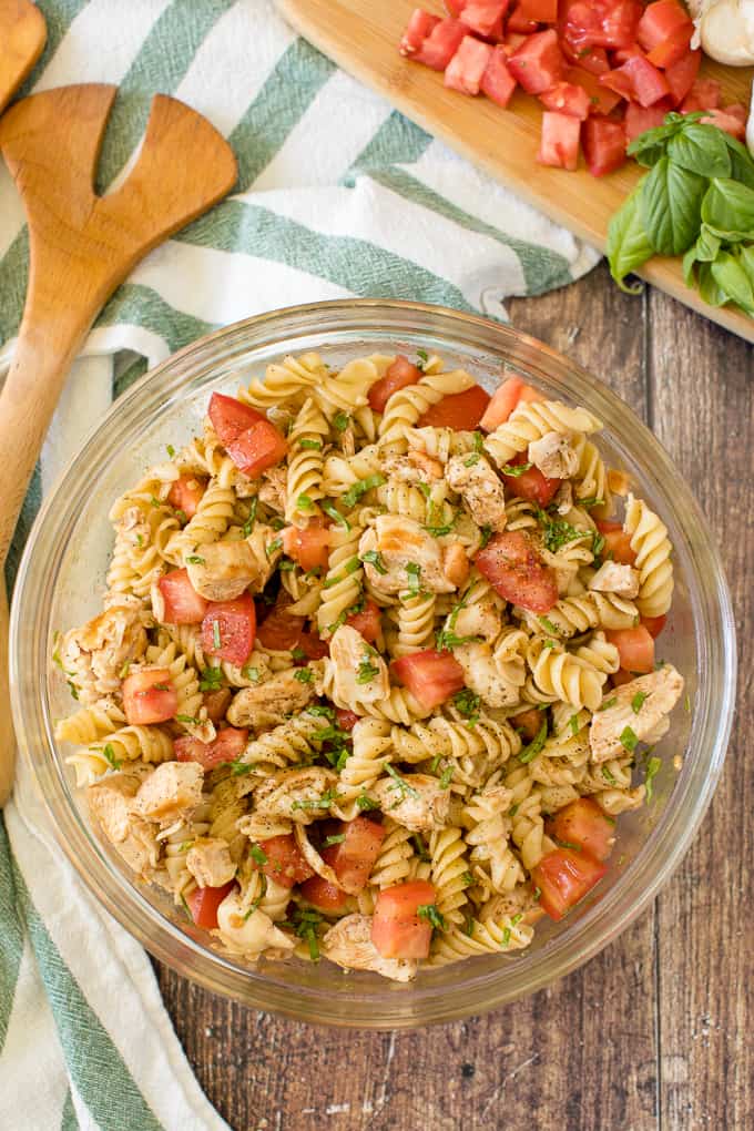 Bruschetta Chicken Pasta Salad - The best pasta salad! Add fresh tomatoes and basil for an amazing summer side dish packed with protein.