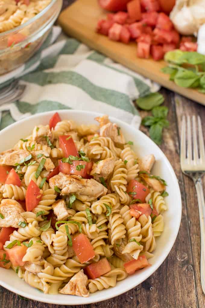 Bruschetta Chicken Pasta Salad - The best pasta salad! Add fresh tomatoes and basil for an amazing summer side dish packed with protein.