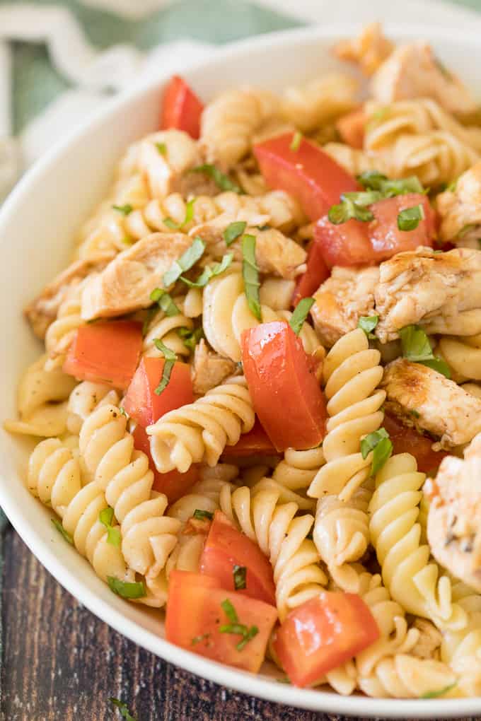 Bruschetta Chicken Pasta Salad - The best pasta salad! Add fresh tomatoes and basil for an amazing summer side dish packed with protein.