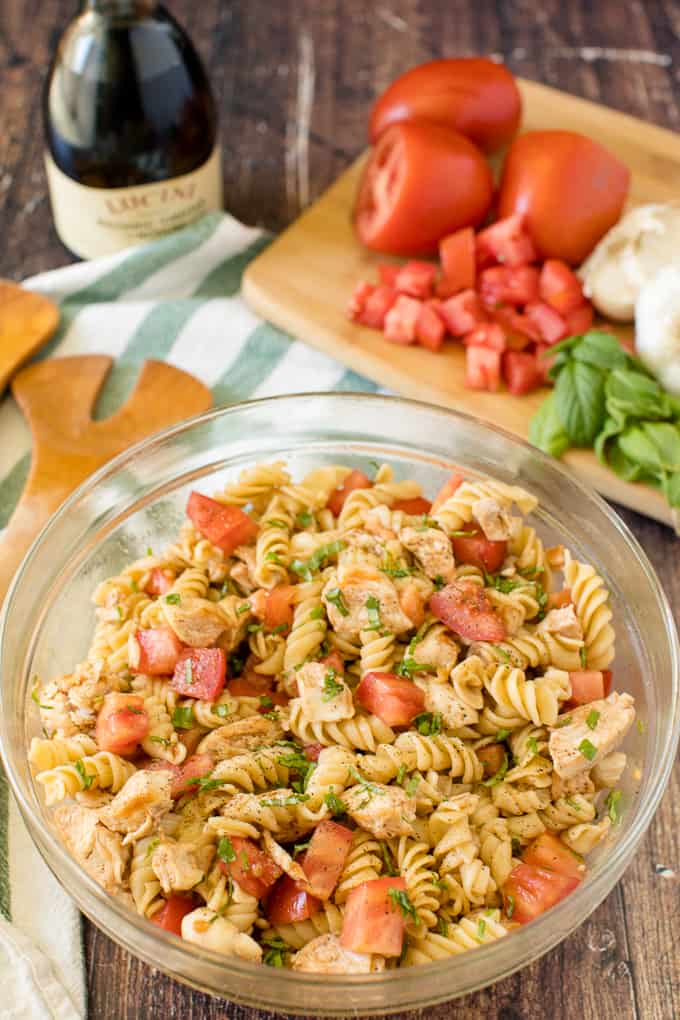 Bruschetta Chicken Pasta Salad - The best pasta salad! Add fresh tomatoes and basil for an amazing summer side dish packed with protein.