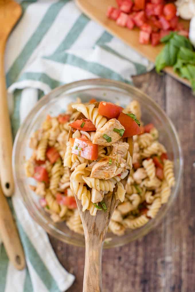 Bruschetta Chicken Pasta Salad - The best pasta salad! Add fresh tomatoes and basil for an amazing summer side dish packed with protein.