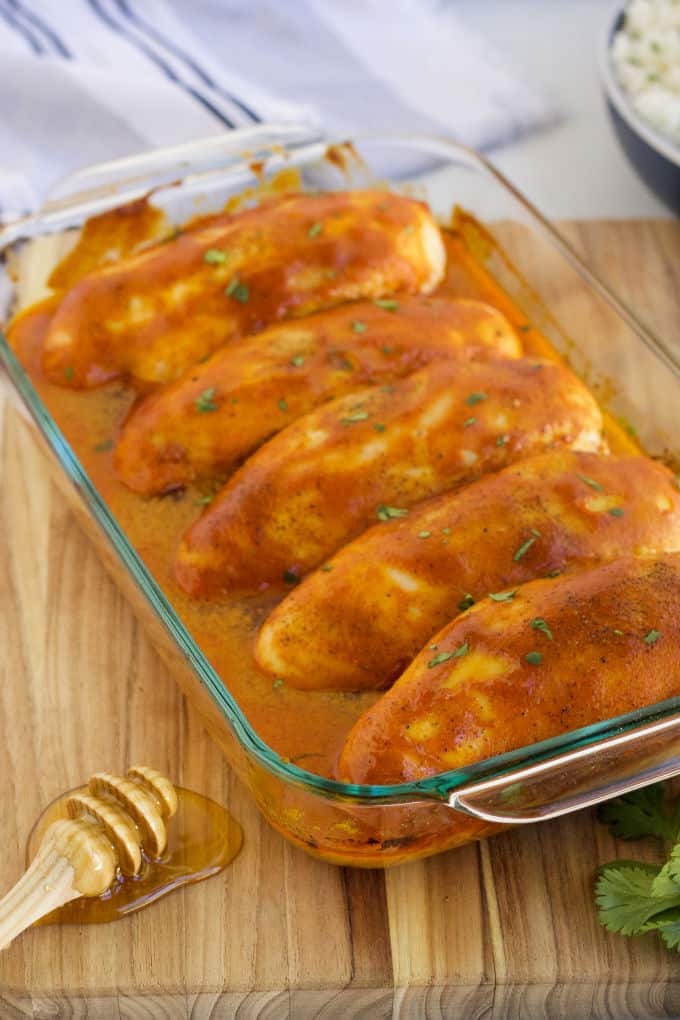 Honey Dijon Chicken - ​No dry chicken here! Take your juicy baked chicken breasts from basic to amazing with this sweet and savory marinade. Chicken breasts smothered in honey, Dijon mustard and spices and then baked to perfection!​