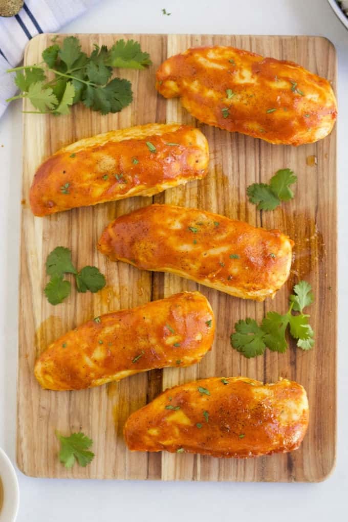 Honey Dijon Chicken - ​No dry chicken here! Take your juicy baked chicken breasts from basic to amazing with this sweet and savory marinade. Chicken breasts smothered in honey, Dijon mustard and spices and then baked to perfection!​